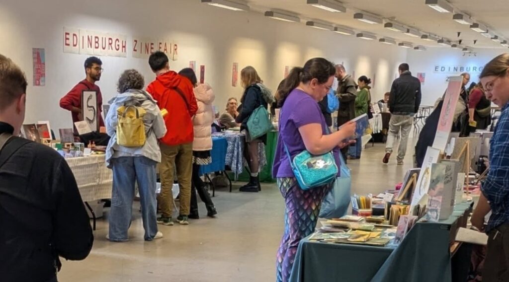 People browsing stalls at Edinburgh Zine Fair